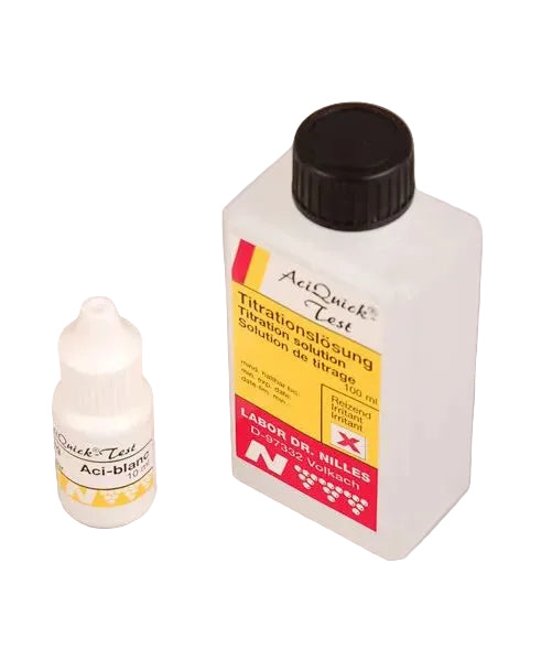 Two bottles of reagent solution for Aciquick test kit, one with a label and one without a label, against a plain background.