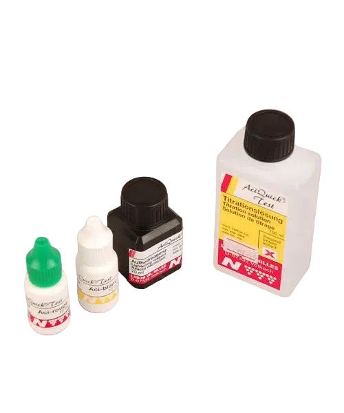 Three bottles of reagent solutions for Aciquick test kit, displayed against a neutral background. From left to right: a small bottle with a green cap, a medium-sized bottle with a black cap, and a large bottle with a red and yellow label.