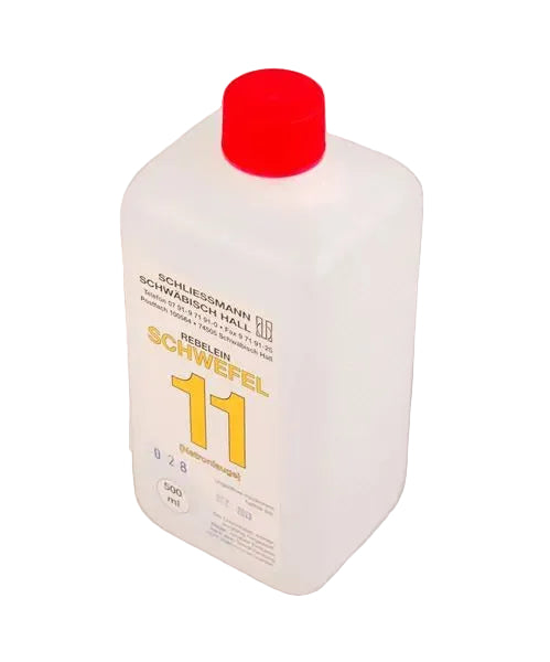 A white plastic bottle with a red cap labeled 'SCHWIEFEL 11' used for the Titrofix kit.