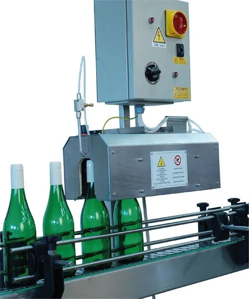 Automatic capsule distributors & shrinkers