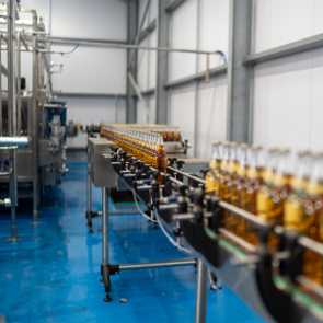 Hunt's Cider bottles on a bottling line inside a production facility