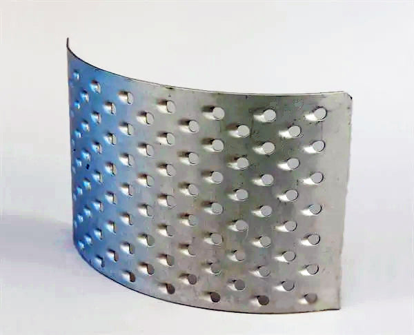 Metallic grater for RM2.2 mill with perforations on a white background