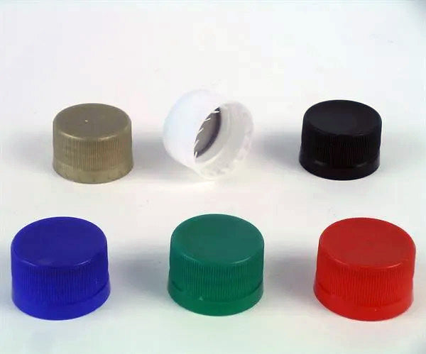 Set of colorful bottle screw caps on a white background