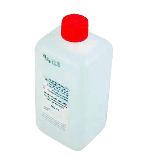 Clear bottle with a red cap on a white background