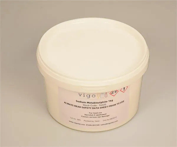 White container of Sodium Metabisulphite 1kg with a label on a beige background