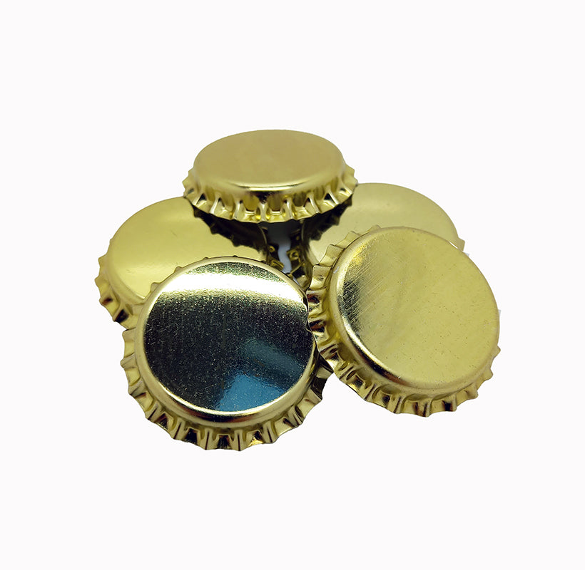 Gold crown caps on a white background